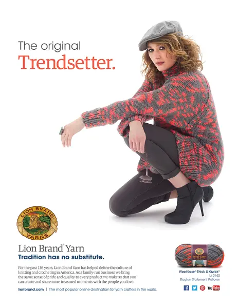 A woman in a crouched pose, wearing a grey cap and a large, oversized sweater with a red and grey pattern. She complements her look with black leggings and high-heeled shoes. Her expression is contemplative as she gazes off to the side, slightly away from the camera. The text "The original Trendsetter."