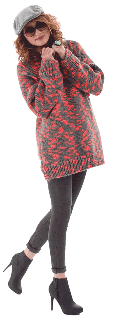 Female model wearing Lion Brand knitted sweater.
